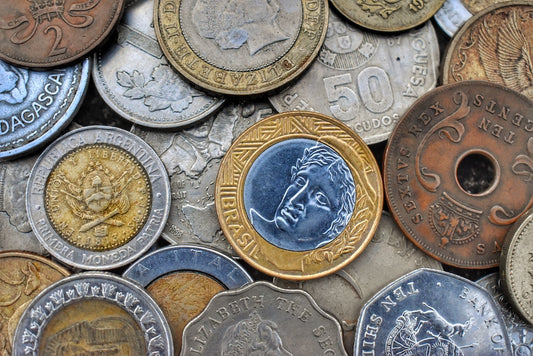 Old foreign coins in a pile